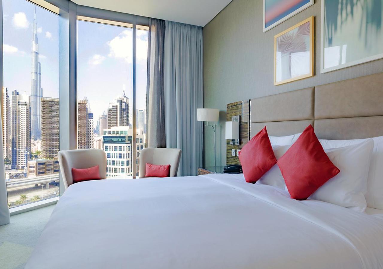 Hyde Hotel دبي المظهر الخارجي الصورة A bedroom at the Address Downtown Hotel